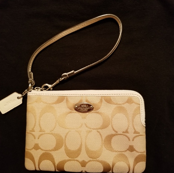 Coach Handbags - Coach corner zip wristlet white and tan